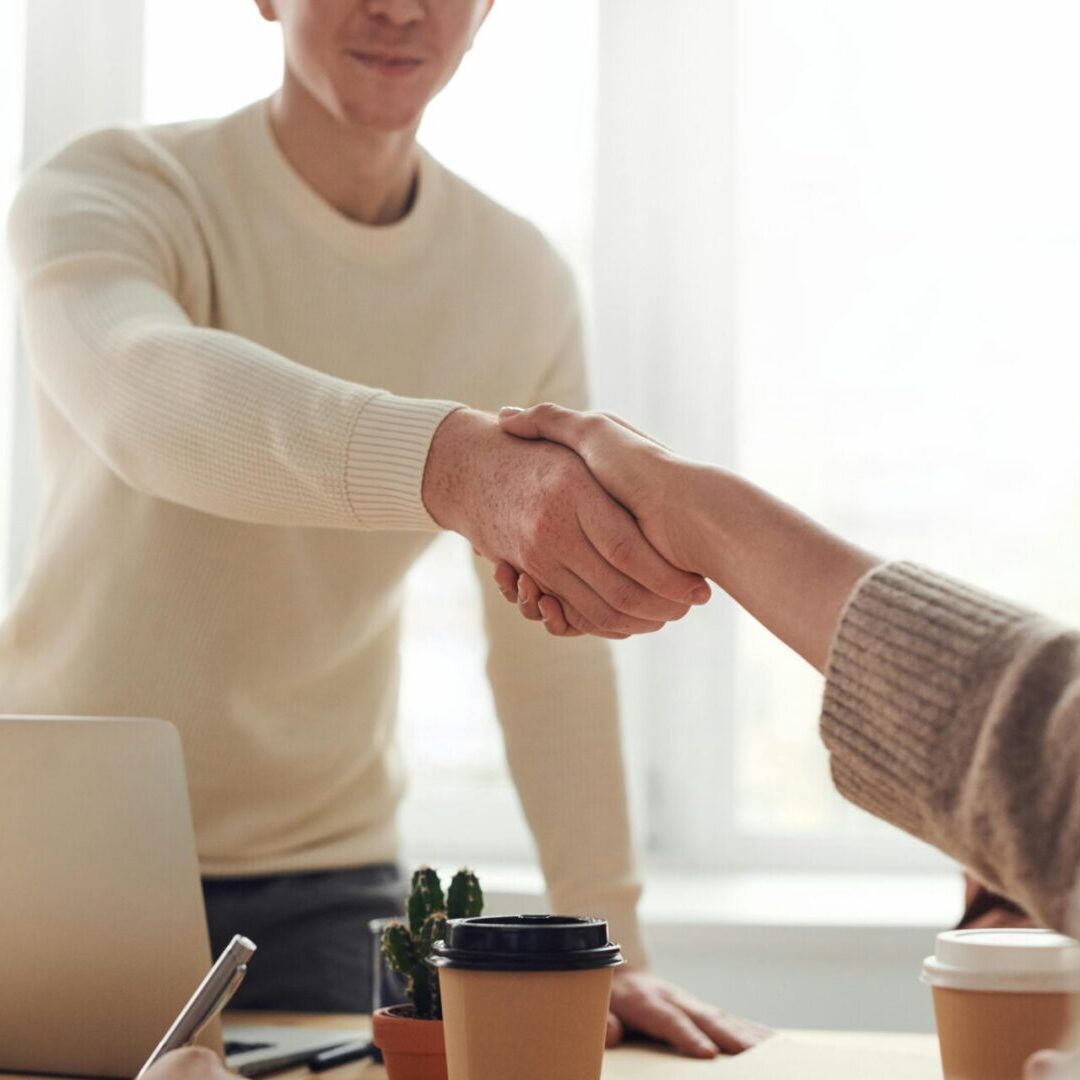 Handshake symbolizing trusted long-term relationships with clients